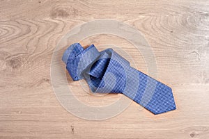 Men`s accessories men`s tie on a wooden background. Classic men`s accessories. Top view