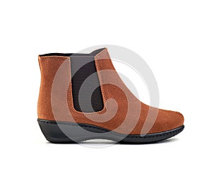 Men`s ankle brown nubuck boot with nubuck leather isolated on white background, closed up