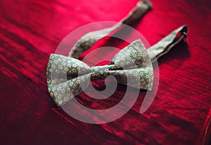 Men`s bow tie on a red background