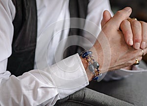 Men's bracelet of natural stones on the hand