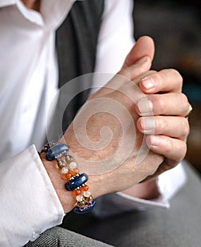 Men's bracelet of natural stones on the hand