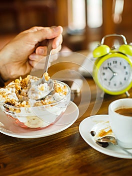 Men's breakfast with coffee and muesli