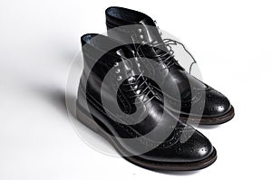 Men& x27;s classic black deep shoes isolated on white background. Modern men& x27;s black shoes