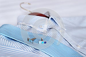 Men's classic shirts on the bed. Shallow depth of field