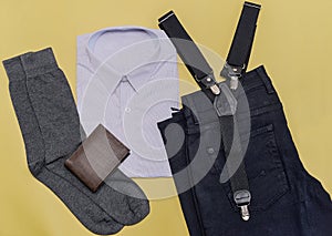 Men`s clothing and accessories on yellow background