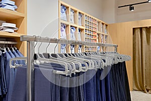 Men`s clothing store. Pants, suits, shirts, tie