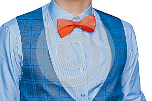 Men's clothing style fashion red bow tie white shirt and blue vest on isolated background