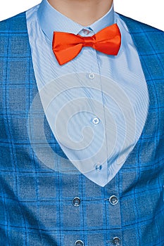 Men's clothing style fashion red bow tie white shirt and blue vest on isolated background, close up