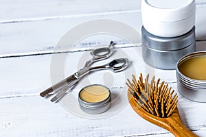 Men`s cosmetics for hair care on wooden background