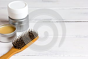 Men`s cosmetics for hair care on wooden background