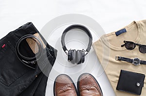 Men`s fashion, casual outfits with accessories. Flat lay, top view on white background, black jeans and t-shirt with boots.