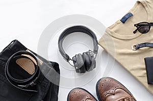 Men`s fashion, casual outfits with accessories. Flat lay, top view on white background, black jeans and t-shirt with boots.