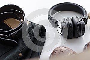 Men`s fashion, casual outfits with accessories. Flat lay, top view on white background, black jeans and t-shirt with boots.