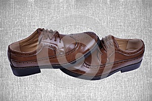 Men`s fashion shoes brown isolated on abstract background