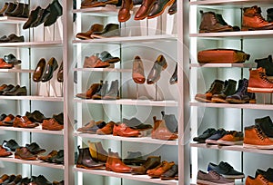 Men`s fashion store, shelves with leather shoes