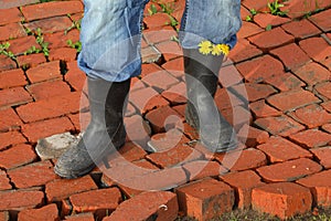 Men`s feet in boots.