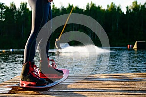 men s feet on a wakeboard