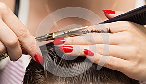 Men`s hair cutting scissors in a beauty salon