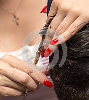 Men`s hair cutting scissors in a beauty salon