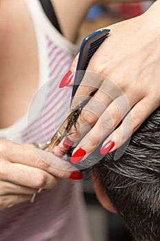 Men`s hair cutting scissors in a beauty salon