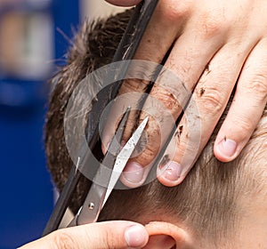 Men`s hair cutting scissors in a beauty salon