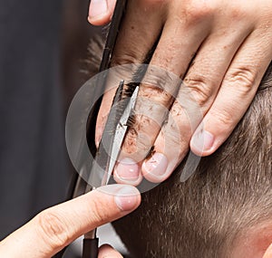 Men`s hair cutting scissors in a beauty salon