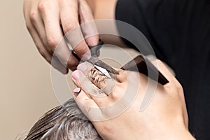 Men`s hair cutting scissors in a beauty salon