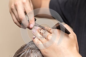 Men`s hair cutting scissors in a beauty salon