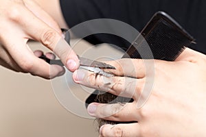 Men`s hair cutting scissors in a beauty salon