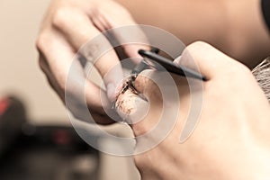 Men`s hair cutting scissors in a beauty salon