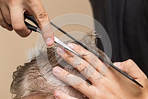 Men`s hair cutting scissors in a beauty salon