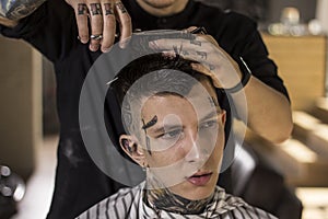 Men`s hairstyling and haircutting in a barber shop . Men`s Hairdressers barbers.