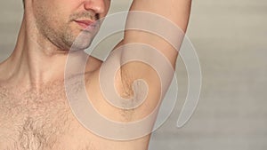 Men`s hairy armpit close-up