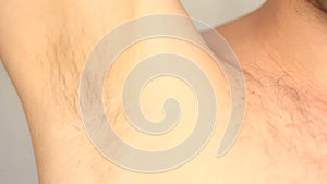 Men`s hairy armpit close-up
