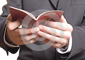 Men's hand showing passport