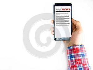 Men's hands in a checkered hipster shirt are holding a smartphone on a white background. The screen is white and black. Hands