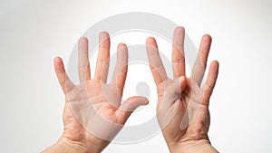 Men& x27;s hands gesture counting on fingers nine palmar side