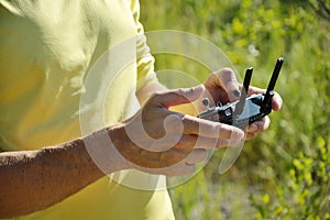Men`s hands that hold drone close-up