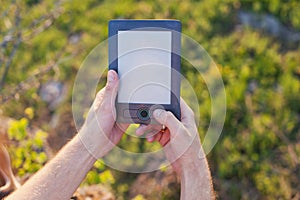 Men's hands hold an eBook