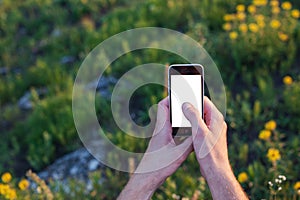 Men's hands touch screen of the phone