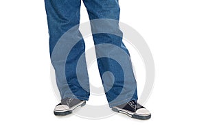 Men's jeans and gumshoes. photo