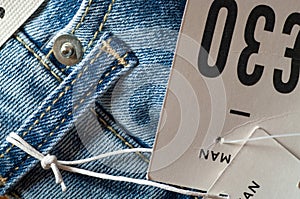 Men`s jeans with price tag.