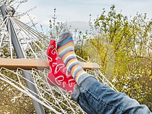 Men`s legs and bright socks. Close-up, outdoor
