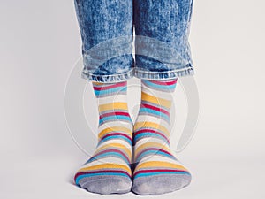 Men`s legs and bright socks. Without shoes