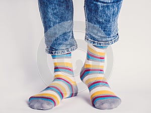 Men`s legs and bright socks. Without shoes