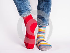 Men`s legs and bright socks. Without shoes