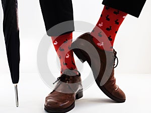 Men`s legs in bright socks and stylish shoes