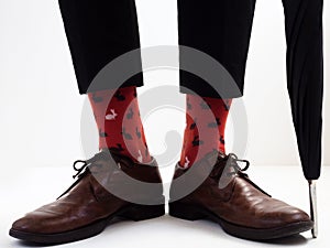 Men`s legs in bright socks and stylish shoes