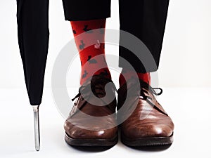 Men`s legs in bright socks and stylish shoes