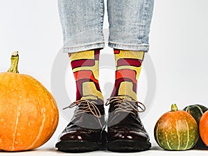 Men`s legs, fashionable shoes and colorful socks